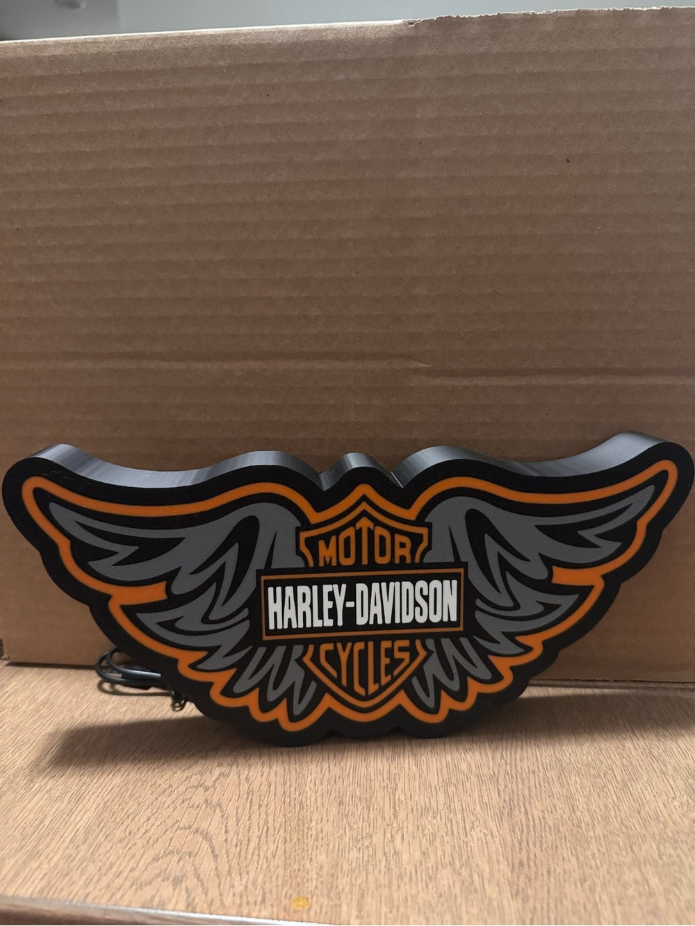 Winged motorcycle emblem light sign, orange backlight, view 4