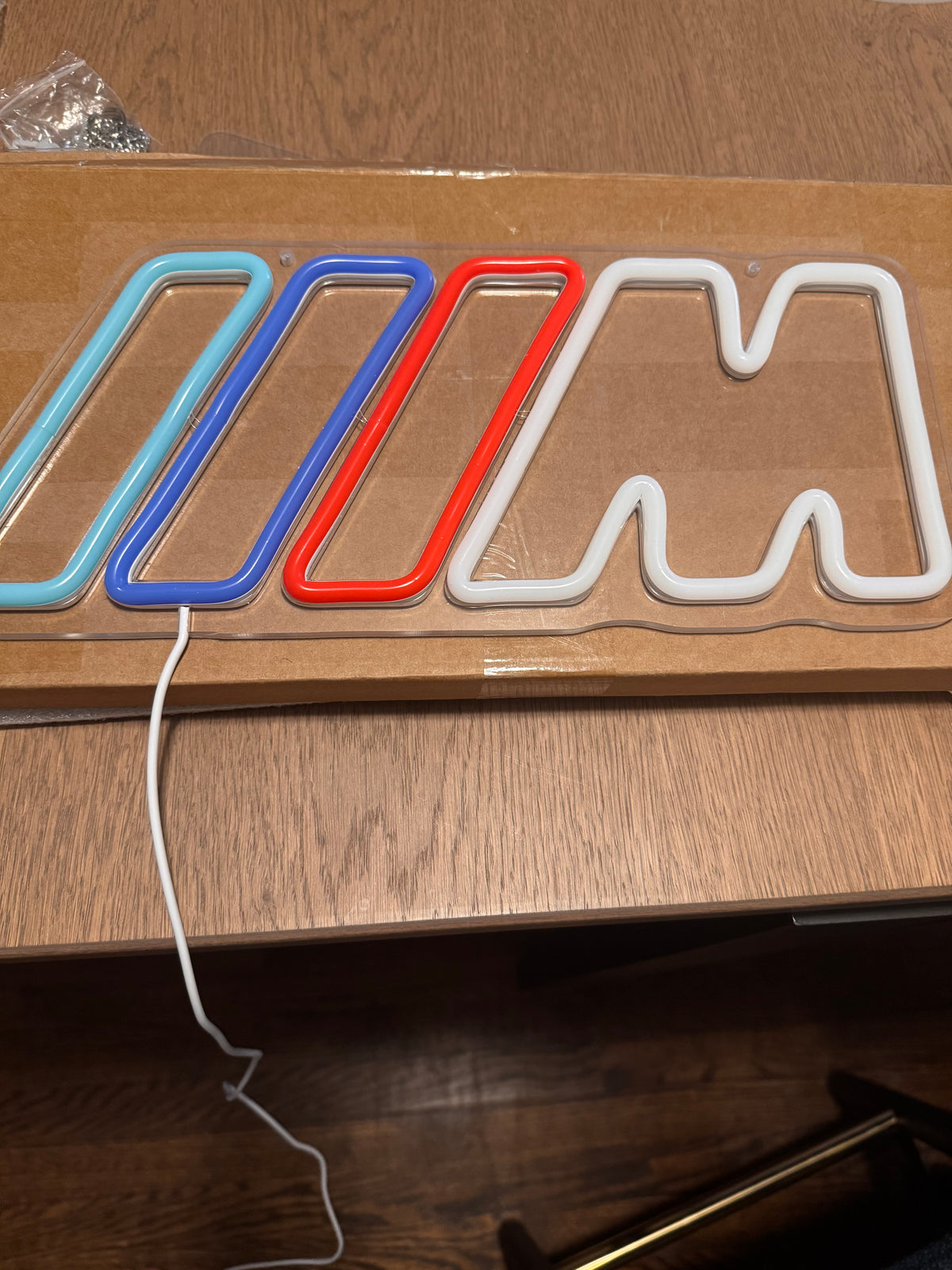 BMW M LED neon sign switched off on its clear acrylic backing
