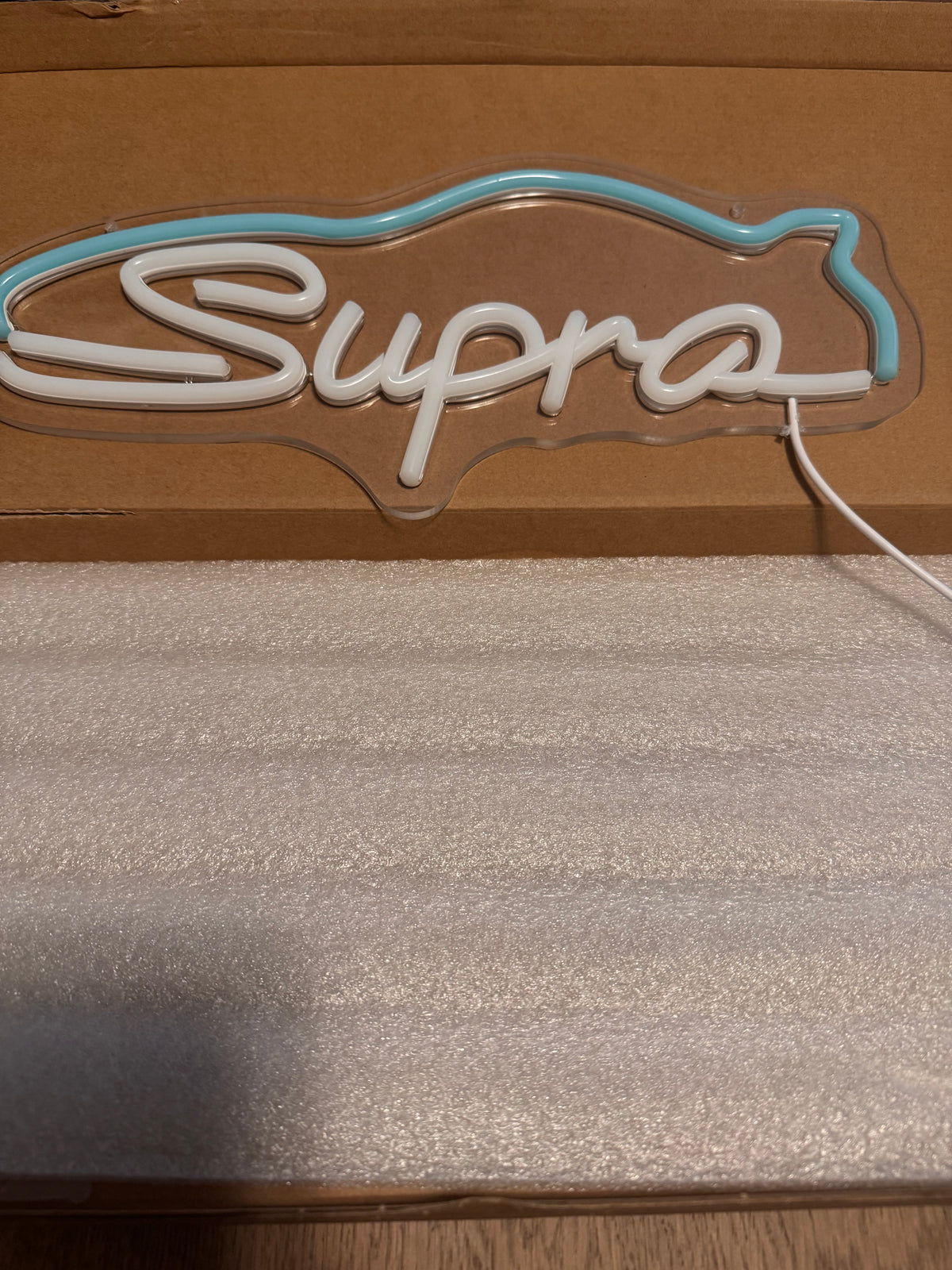 Toyota Supra LED neon sign switched off on its clear acrylic backing