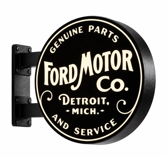 Black and cream Ford Motor Co. round double-sided light box with black wall brackets