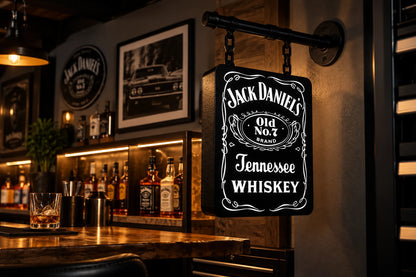 Black and white Jack Daniel's light box hanging from a pipe arm over a home bar
