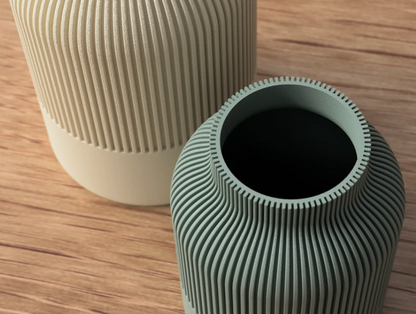 Close-up of the ribbed texture and rim on a sage green vase