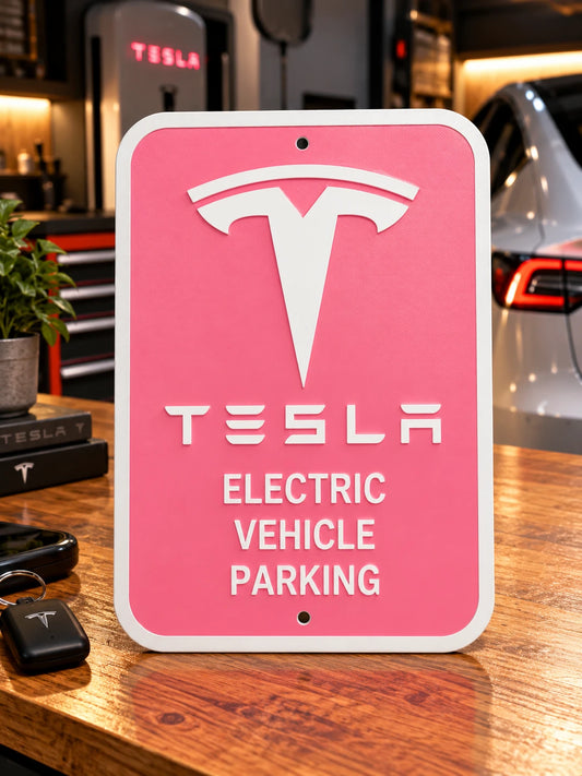 White letters, logo and outline, pink background, Tesla EV parking sign on a wooden desk in a garage