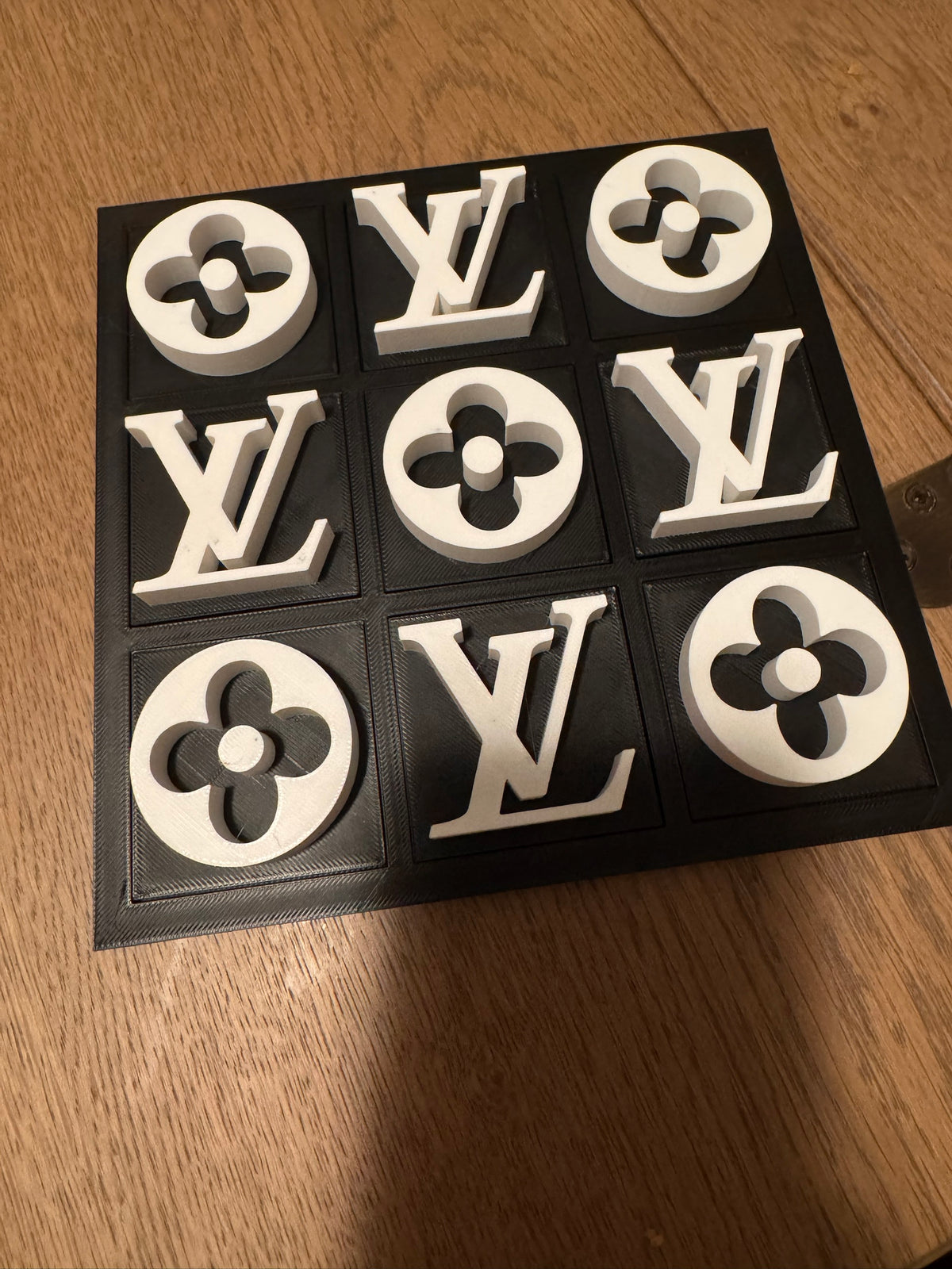 Black board with white pieces, full set on a wood table
