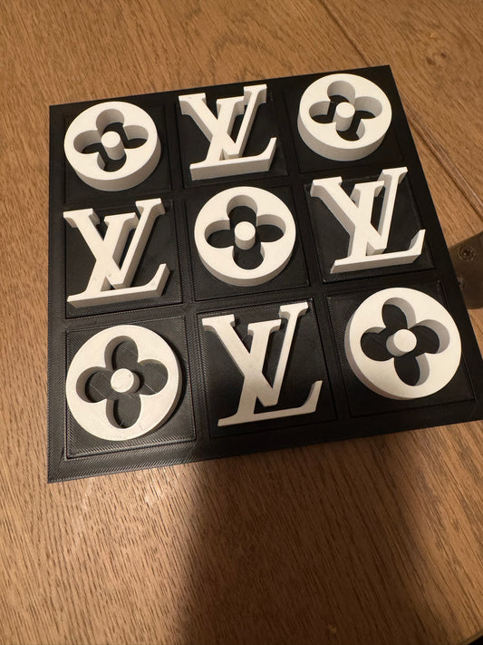 Black board with white pieces, full set on a wood table