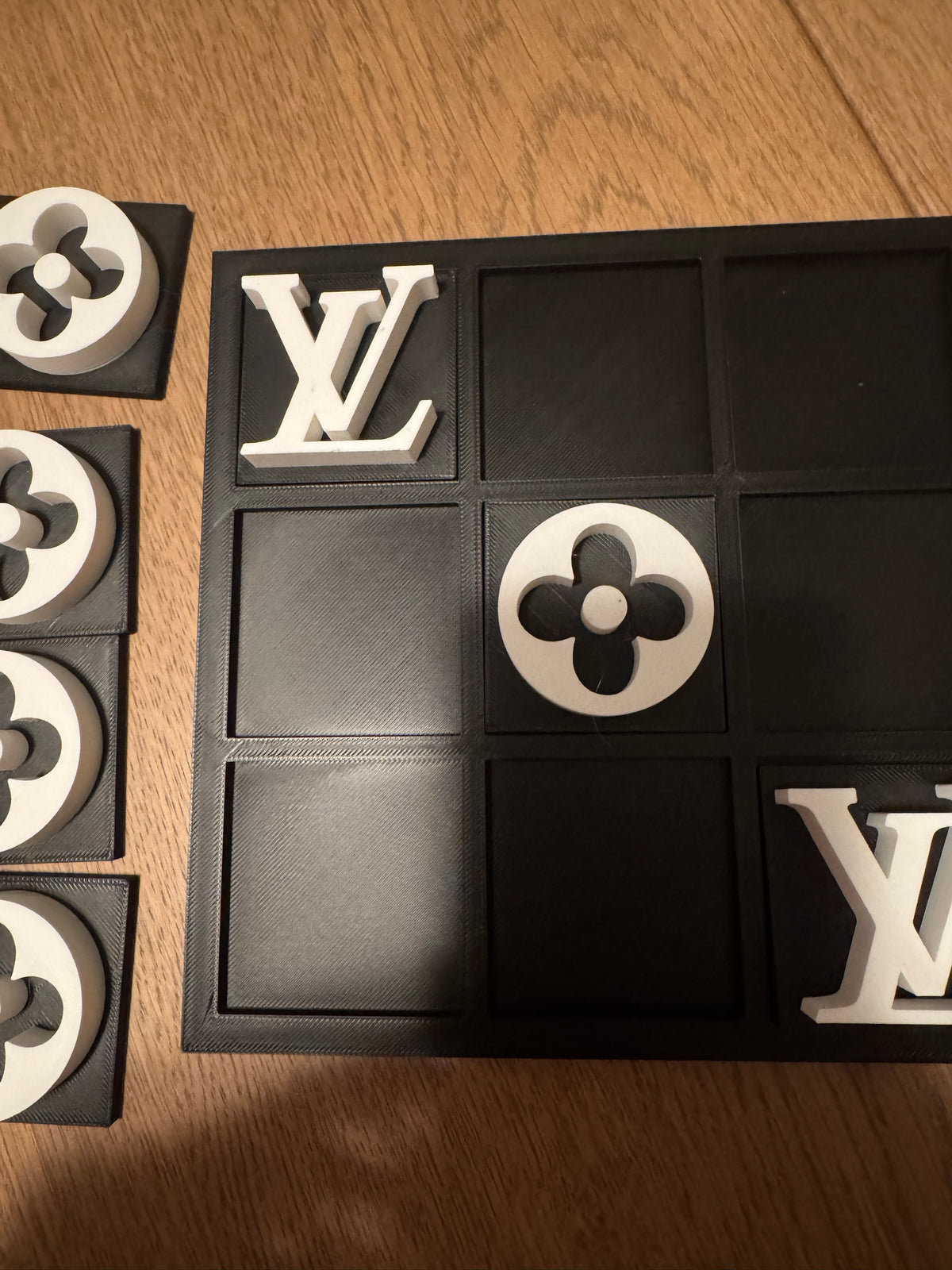 Black board with white pieces, top view mid game