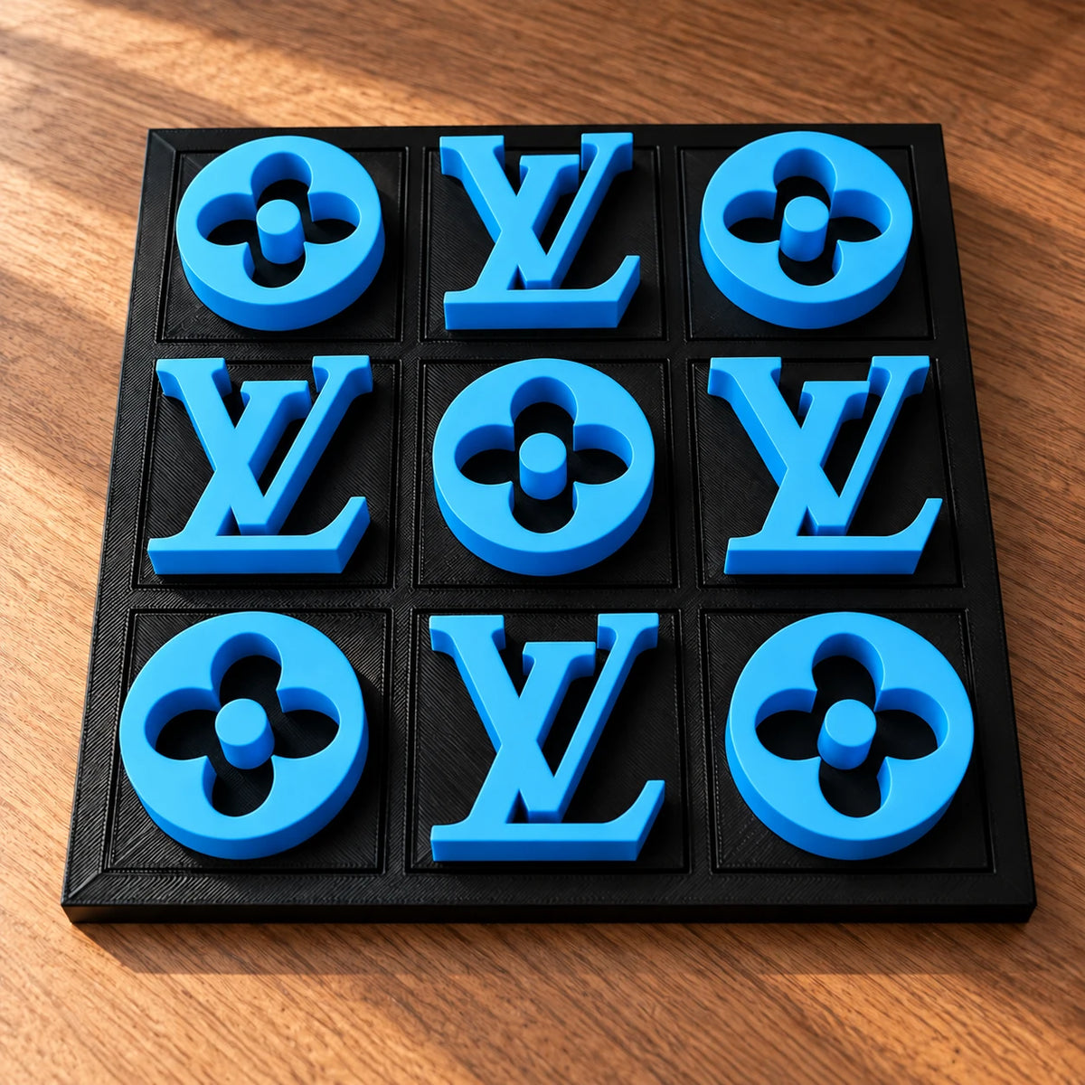 Black board with blue pieces, full set of nine in warm window light