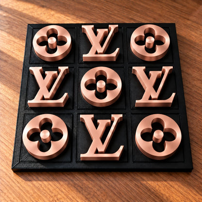 Black board with rose gold pieces, full set of nine in warm window light