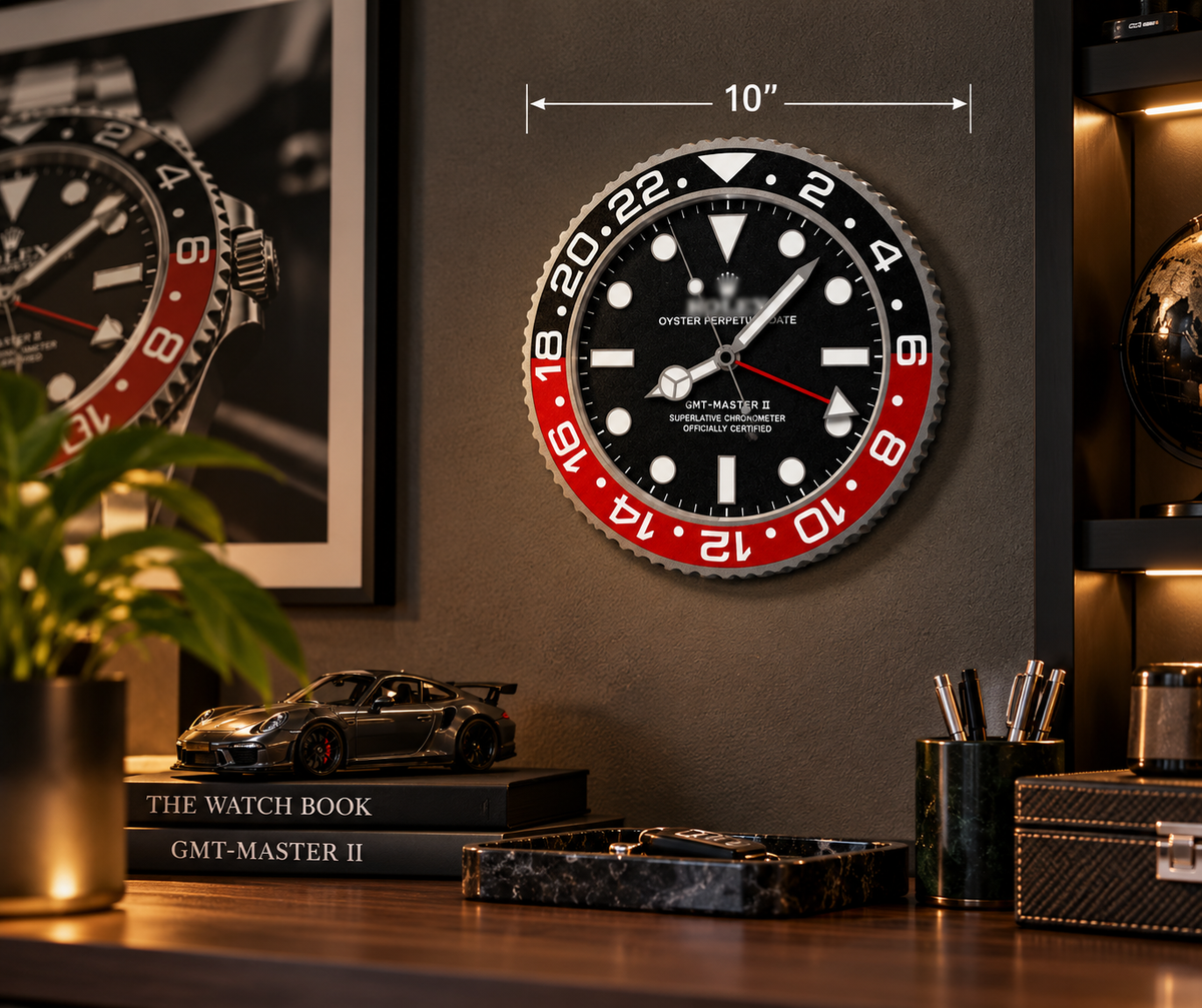 Black and red bezel 10 inch wall clock on a dark wall above a desk